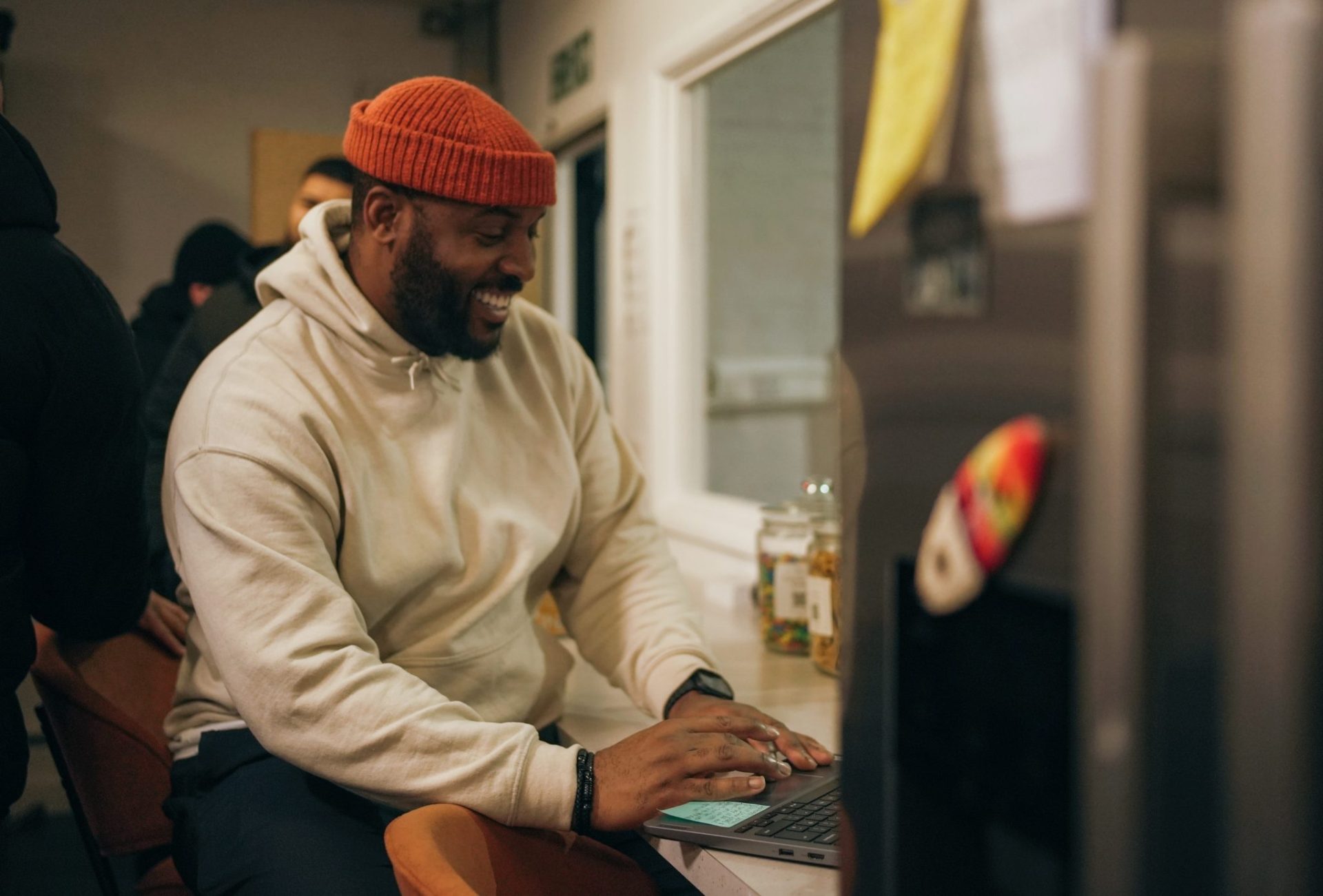 Smiling man workin on a laptop