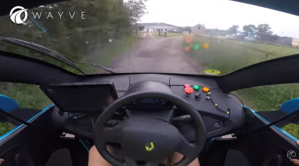 car driving down a narrow country lane
