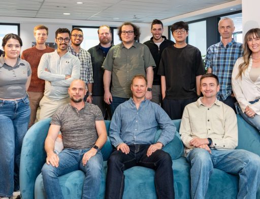 group of people in an office posing for camera