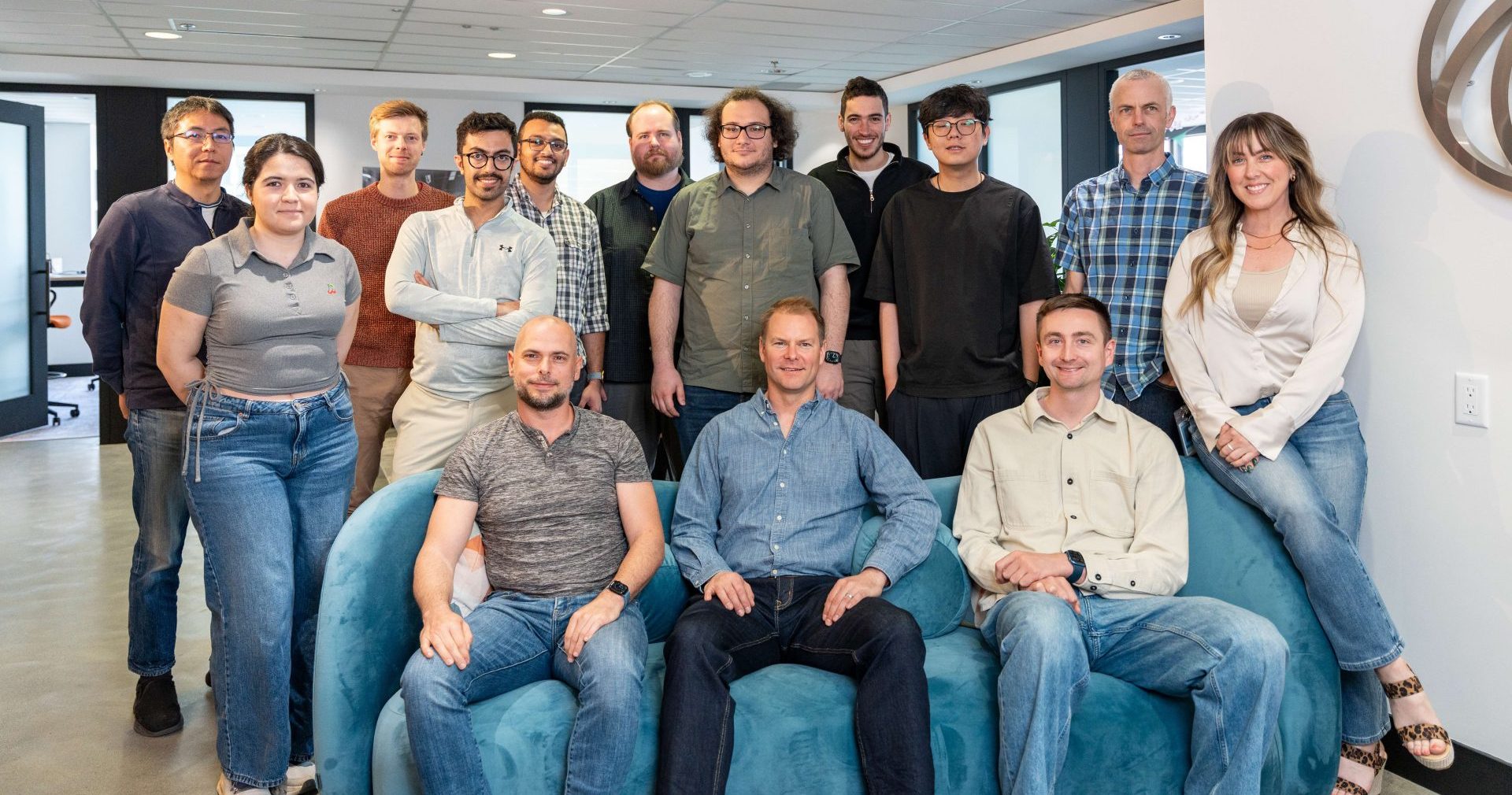 group of people in an office posing for camera