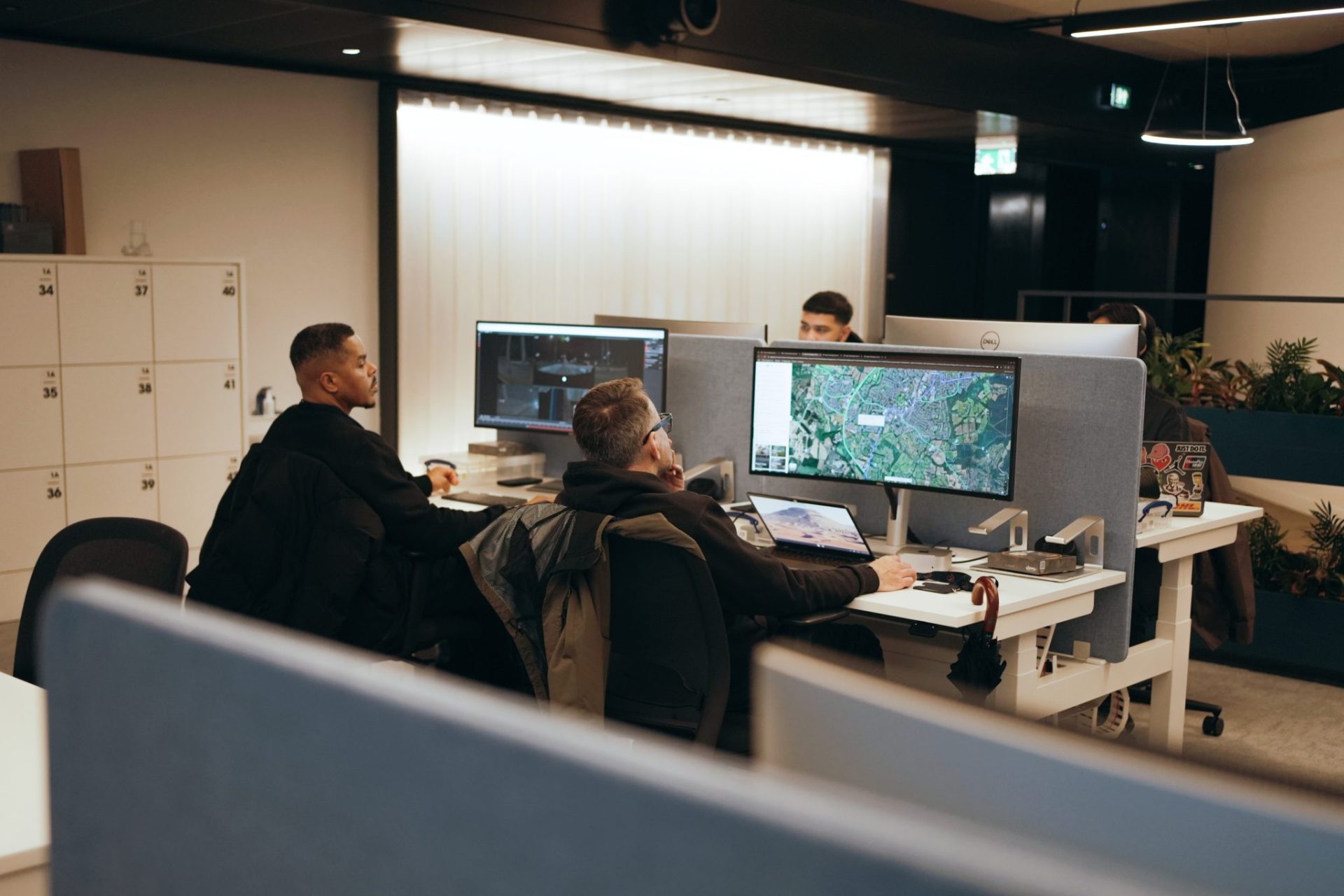 Two men working on their computers in an office