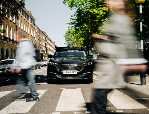 black car stopped at zebra crossing